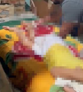 Blurred image of a victim's tied legs.