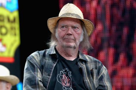 Neil Young at a press conference.