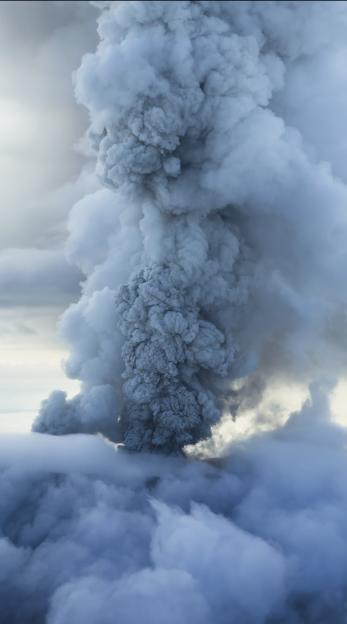 Aerial view of the Krasheninnikov volcano erupting.
