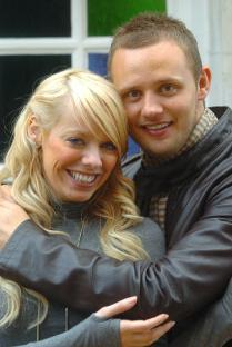 Photo of Liz McClarnon and Lee Trundle hugging.