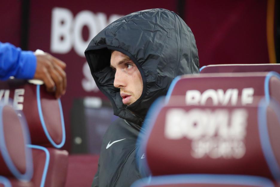 Cole Palmer of Chelsea on the bench at a Premier League game.