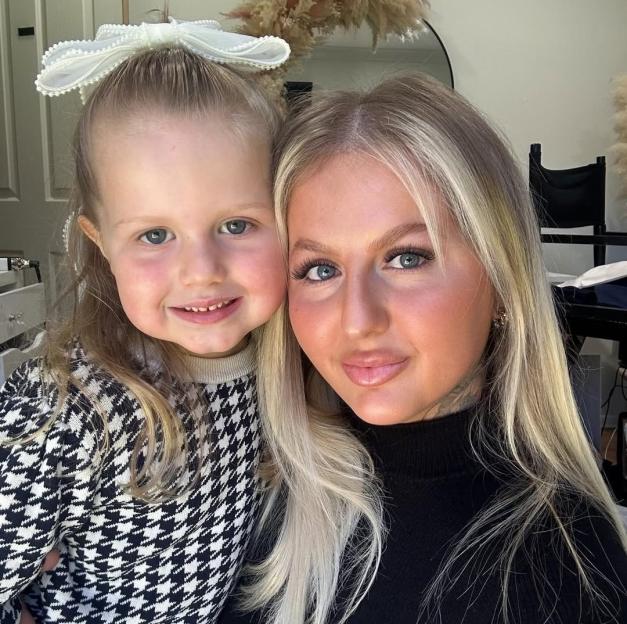 Portrait of a mother and her young daughter.