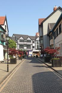 Cobblestone street in a town designed to resemble an English village.