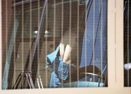 Jimmy Carwyle, seen through a bus window, leaving court.