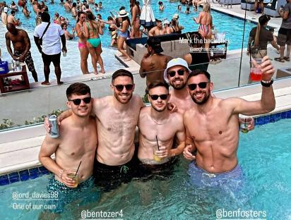Four Wrexham AFC players at a Las Vegas pool party.