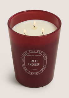 Red Desire candle burning.