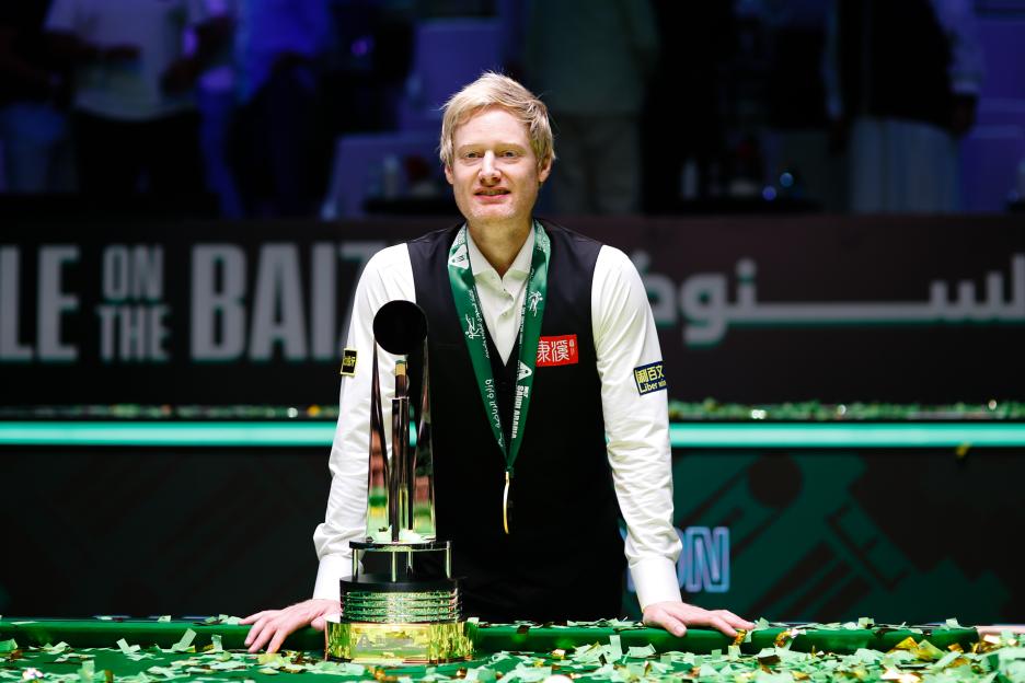 Neil Robertson of Australia with the champion trophy after winning a snooker competition.