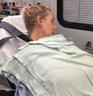 Woman sleeping in an ambulance.