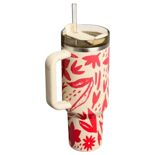 Floral-patterned tumbler with straw and handle.