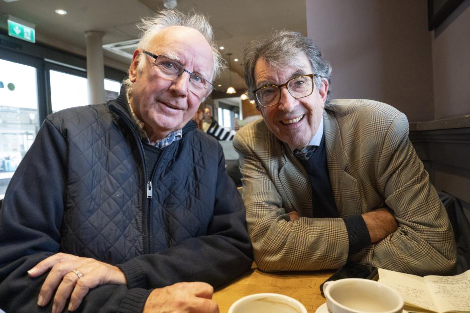 Peter Waterman OBE and writer Mike Ridley smiling at a table.