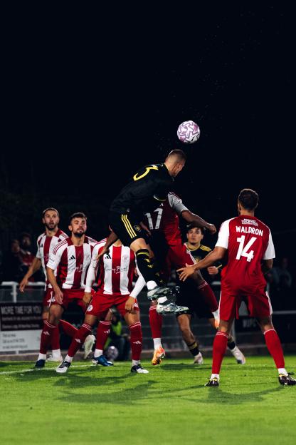 Rhys Bennett of Manchester United heading the ball during an English National League Cup match.