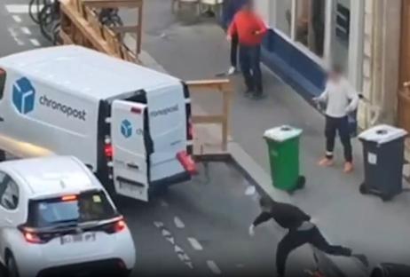 Footage of three masked men attempting to force a woman into a van.