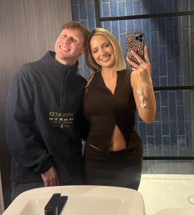 Jamie Borthwick and Jordan Dwyer taking a selfie in a bathroom.