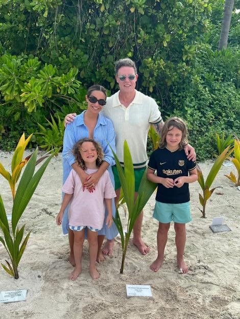 Rochelle Humes and Frankie Bridge with their families planting coconut trees.
