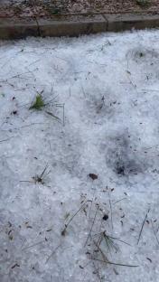 Hail covering the ground.