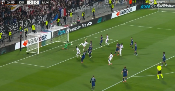 Soccer game in progress, players near the goal.
