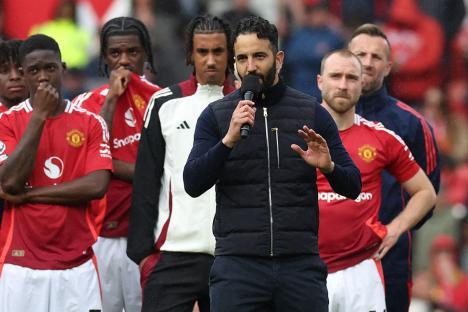 Ruben Amorim, Manchester United's head coach, speaking to supporters after a match.