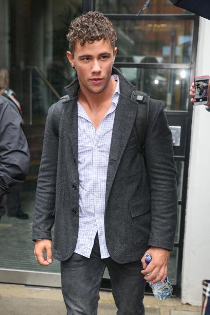 Orpheus Pledger leaving a building in London.