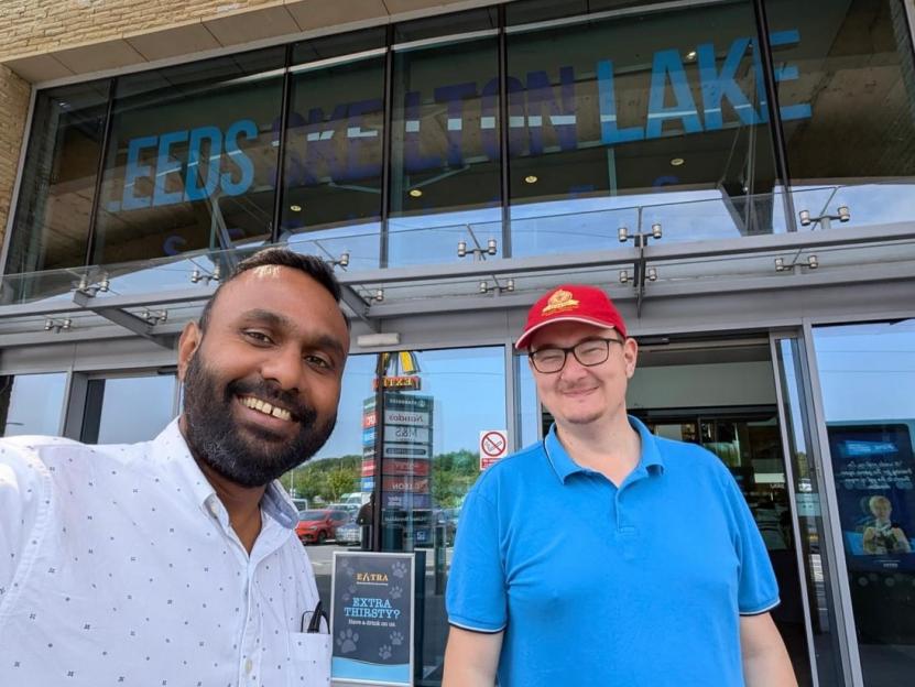 Ram Arul and Rich James Cross standing in front of the Leeds Skelton Lake service station.