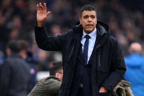Chris Kamara, former Leeds United player, waves to fans.