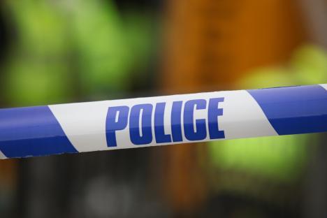 Police tape at an accident scene.