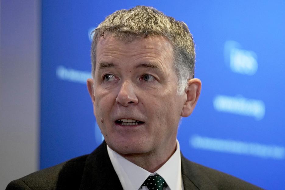 Richard Moore, Chief of Britain's Secret Intelligence Service, answering questions.