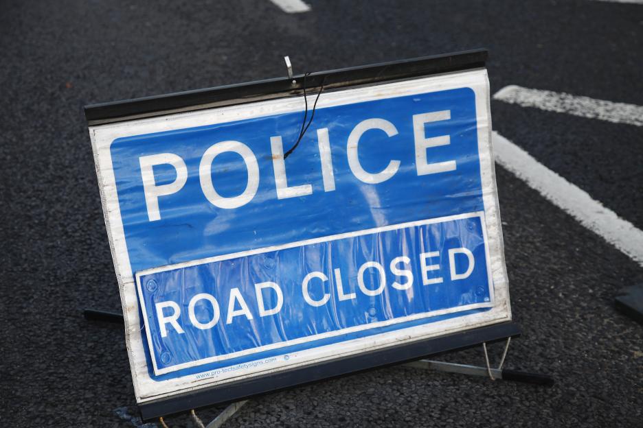 Police road closed sign.