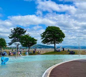 Blackpill Lido, Swansea with people enjoying the water features.