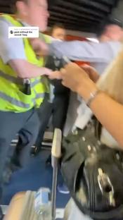 Airport worker and passenger altercation.