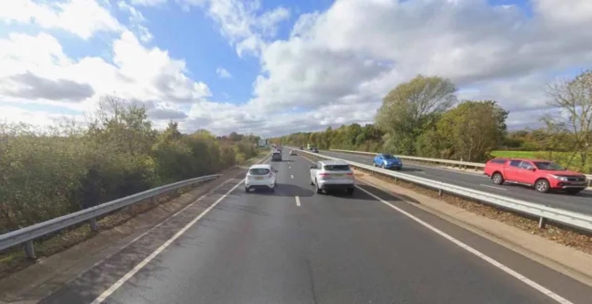 A11 Norfolk highway with several cars driving.