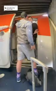 A passenger being restrained at an airplane door.