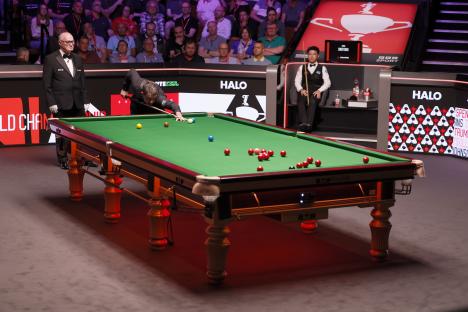 Ronnie O'Sullivan playing snooker.