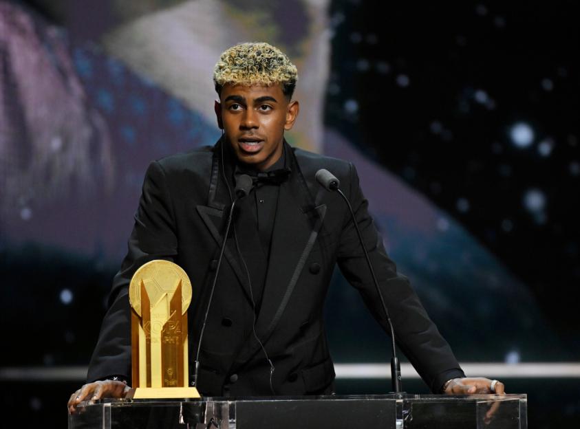 PARIS, FRANCE - SEPTEMBER 22: Lamine Yamal speaks on stage with the Men's Kopa Trophy during the 69th Ballon D'Or Ceremony at Theatre Du Chatelet on September 22, 2025 in Paris, France. (Photo by Kristy Sparow - UEFA/UEFA via Getty Images)