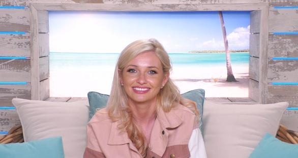 Amy Hart in a beach hut after kissing Curtis on Love Island.