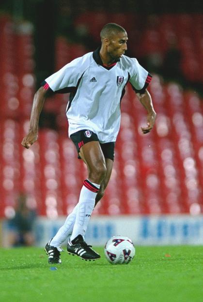 Abdeslam Ouaddou of Fulham FC dribbling the ball during a soccer match.