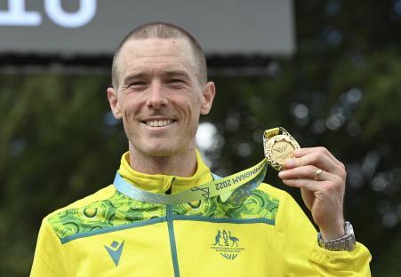 Rohan Dennis, Australian cyclist, holding his gold medal at the Commonwealth Games.
