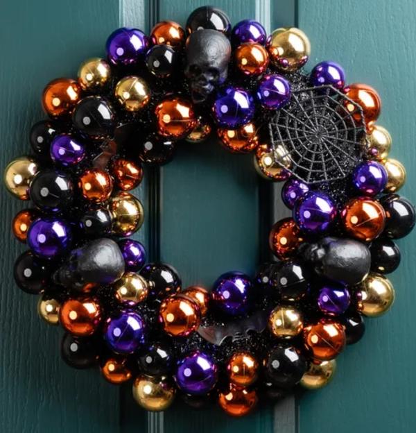 Halloween wreath with skulls and spiderweb.