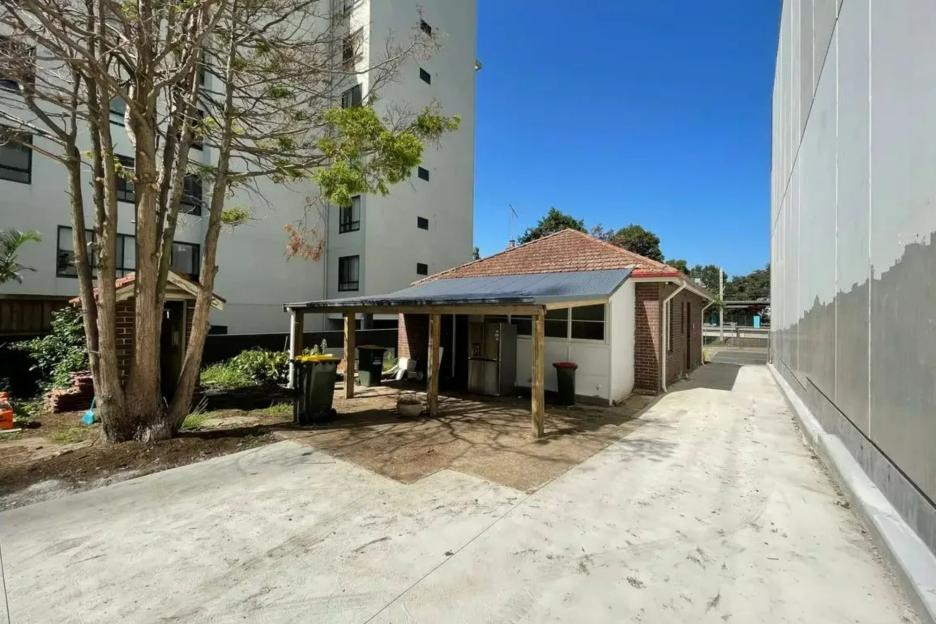 Defiant homeowner secures HUGE 7-figure price for run down 2-bed with outside toilet… after skyscrapers built around her