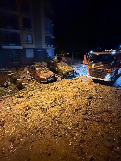 Damage to cars and a building from a bombing in Kyiv.