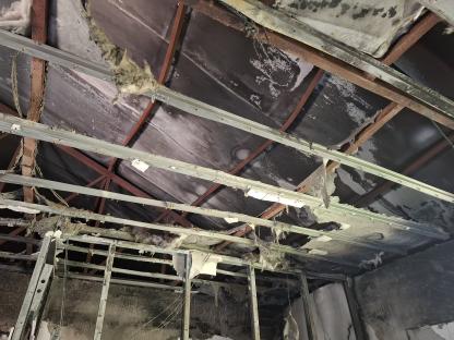 Damage to a ceiling after a fire.