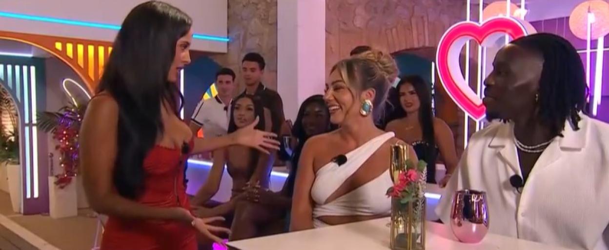 Screenshot of a reality TV show reunion, featuring contestants talking.