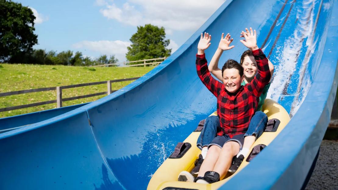 Two boys on a water slide at Camel Creek Adventure Park.