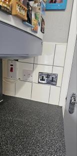 Kitchen countertop with electrical outlets and switches.