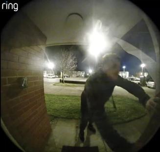 Ring doorbell camera footage of a suspect breaking into a home at night.