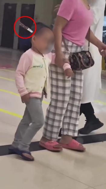 Toddler walking in hospital with knife embedded in head.
