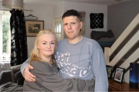 Parents hugging in their home.